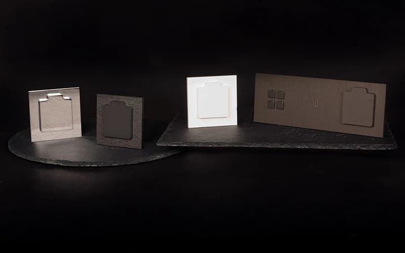 Alphaplate sockets and controls displayed on dark stone