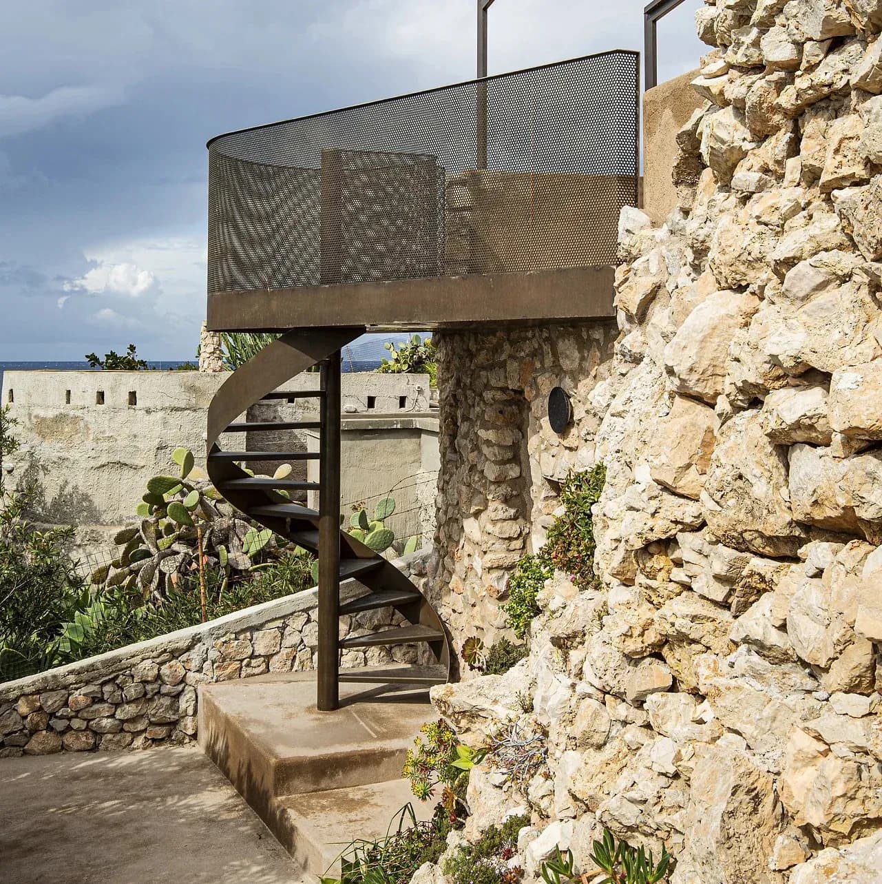 Cortenox spiral stair and perforated balustrade at Villa Egadi